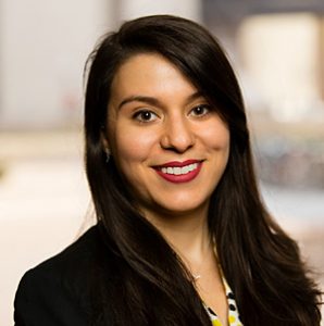 Formal headshot of Melanie Firestone in a black suit jacket 