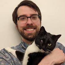 Picture of Alex Bates with cat