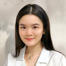 Portrait image of Ngan (Nora) Nguyen in a white shirt